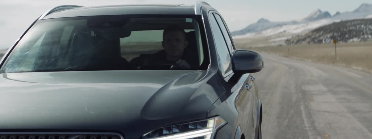 Man drives on a rural road