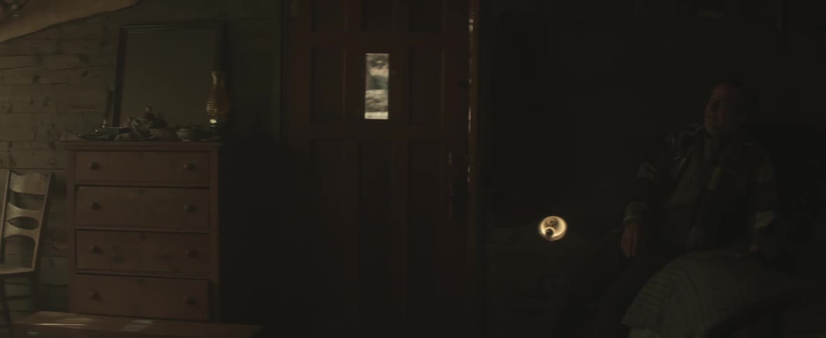 A man with a gun freaking out and falling to the floor