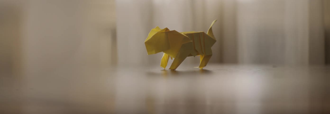 An origami animal sits on a table