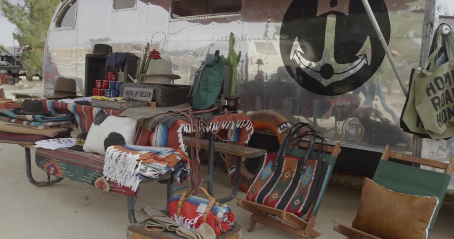 Blankets and cushions sit on display at a market