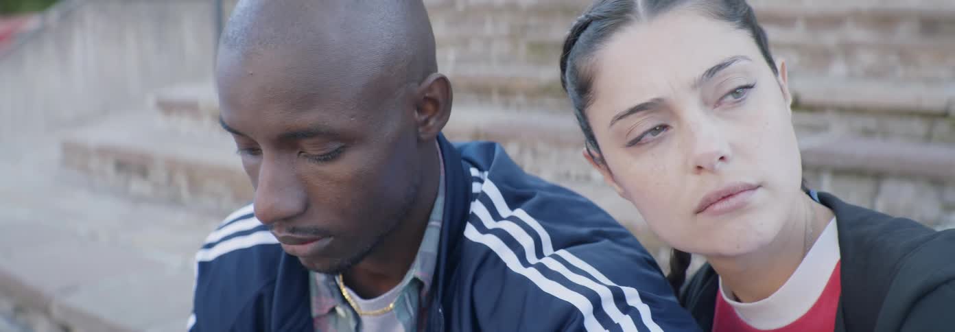 Woman leans her head on a man's shoulder