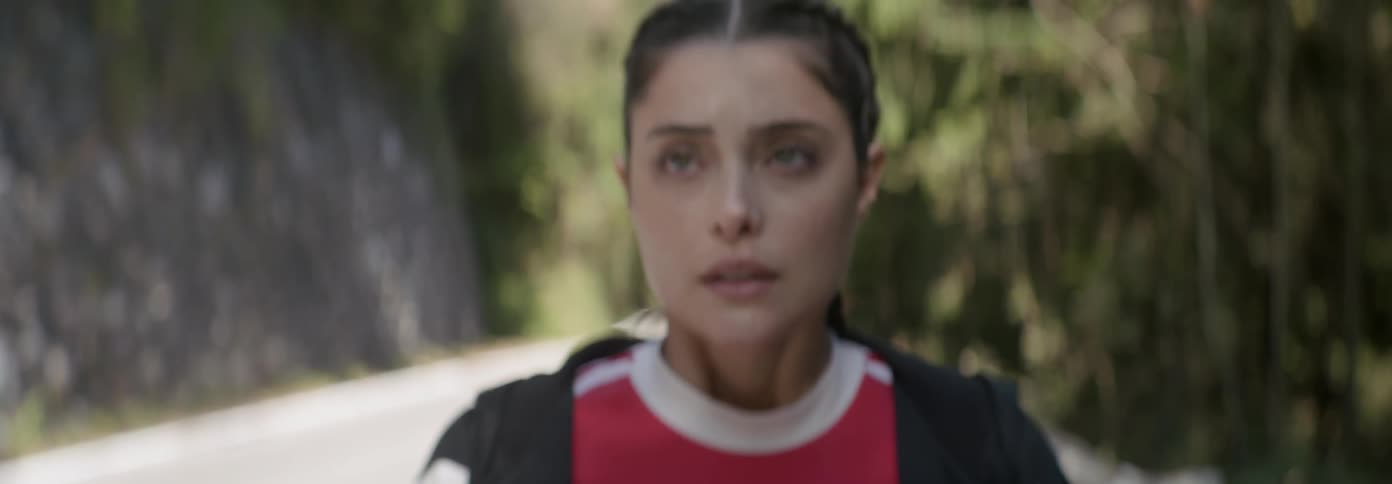 Worried woman breathes heavily on a mountain road