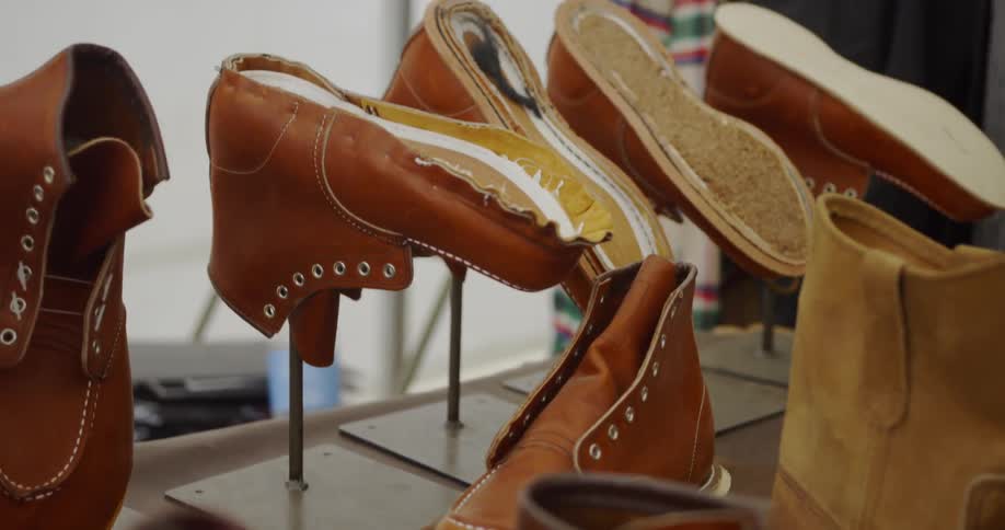 Unfinished shoes are displayed in a shoemaker's shop