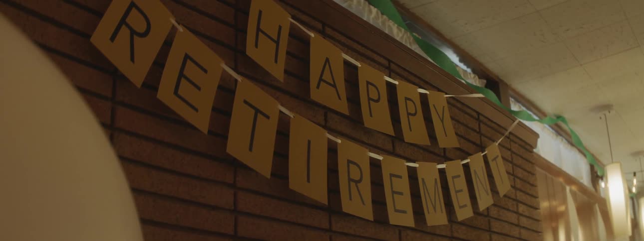 A happy retirement sign is hung in the house
