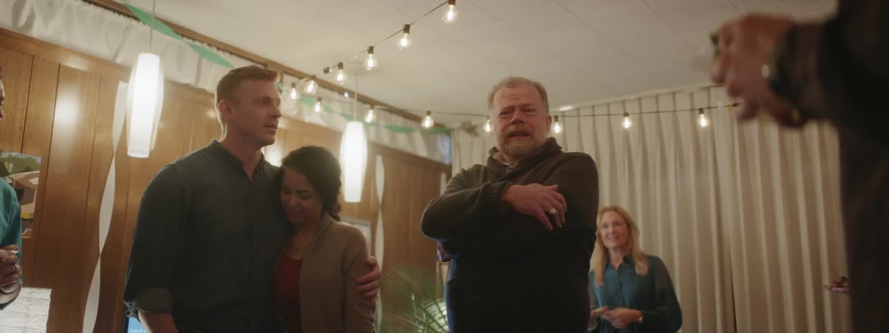 Man speaks at a house gathering