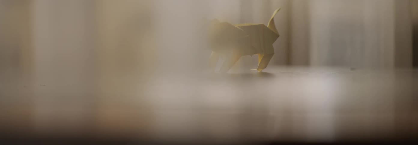 A paper figure sits on the counter