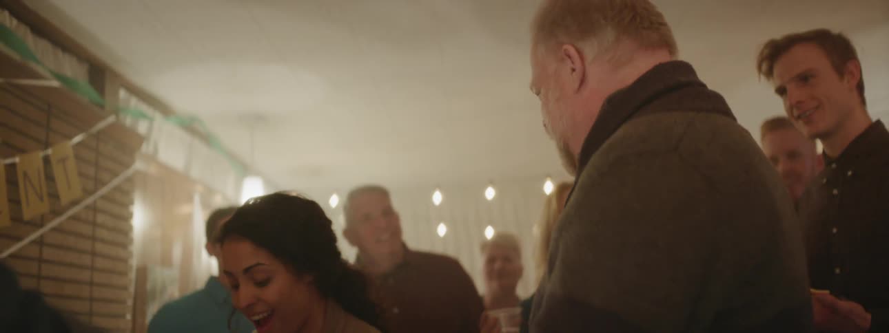 People are gathered at a retirement party