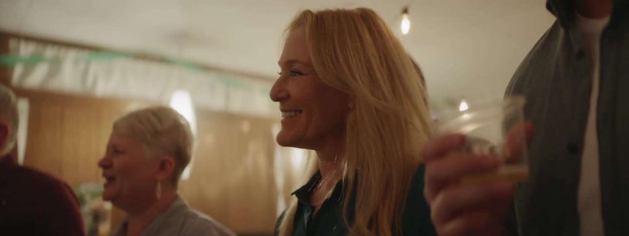 People smile at a house party