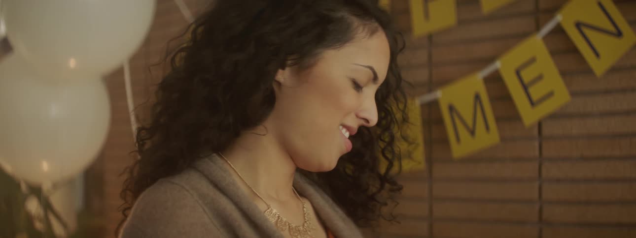 A woman looks around and talks