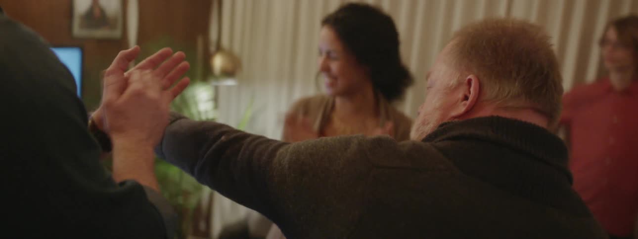 Man sings karaoke at a house party
