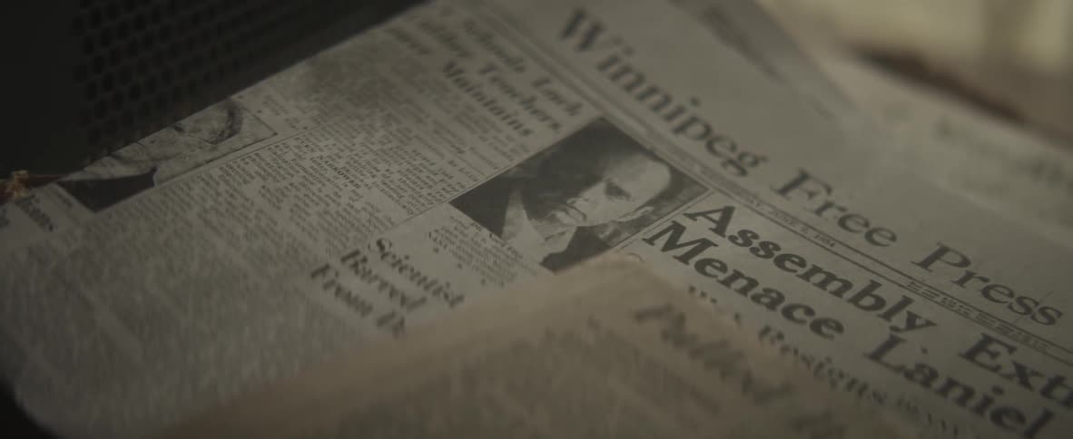 A newspaper is laying on a table indoors