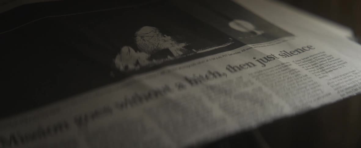 Close up view of a newspaper on a table is displayed