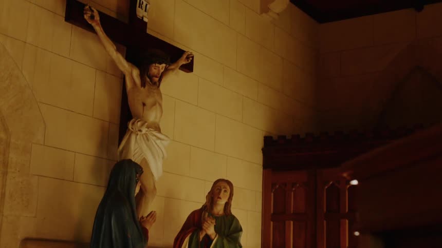 The statues line the wall of the church