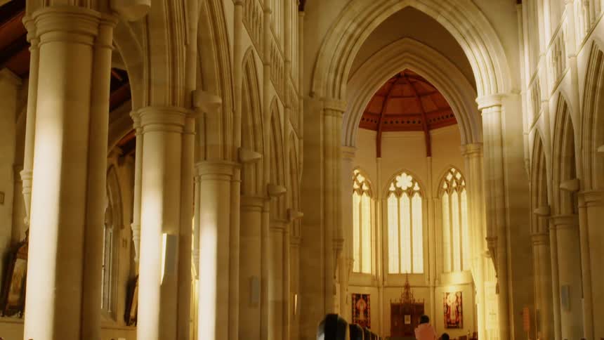 People stand in a cathedral