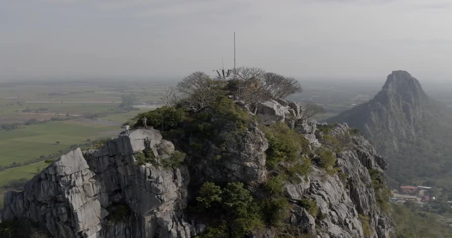 People stand on top of a rocky mountain