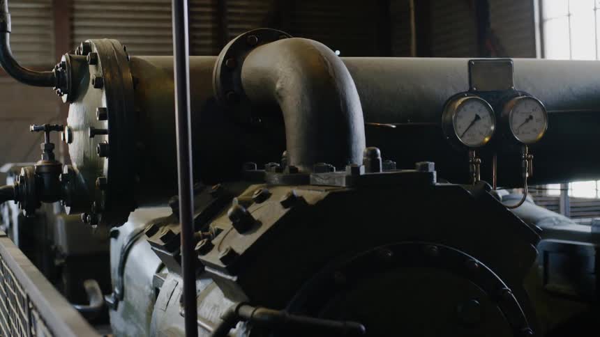 The engine room has many dials and hoses