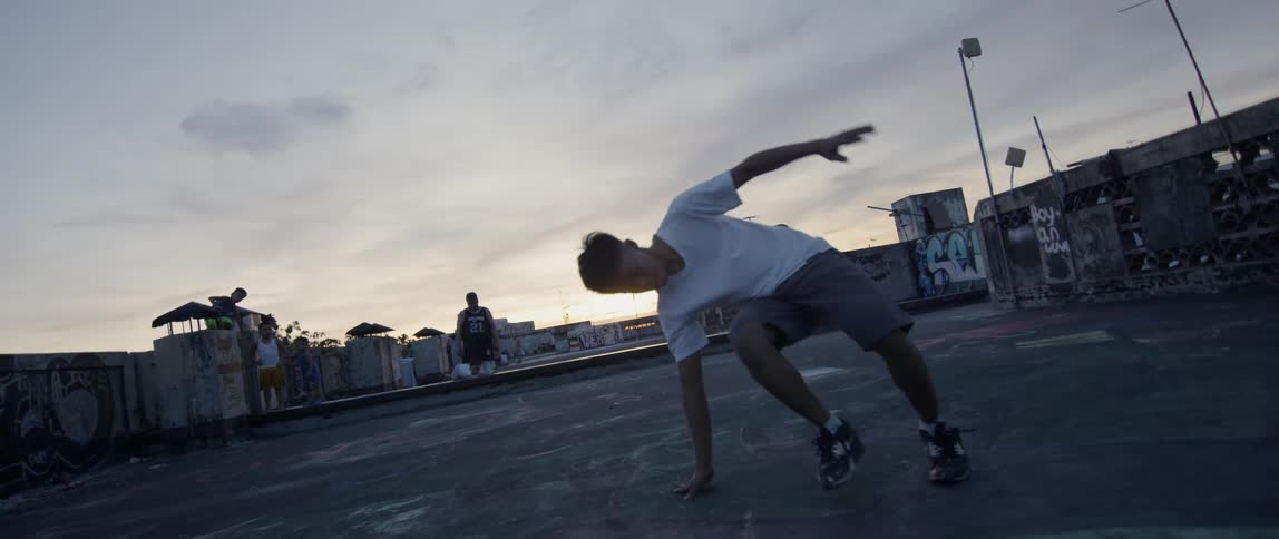 A man is breakdancing on the rough