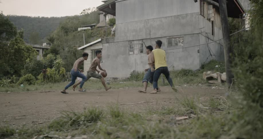 Young kids play basketball together