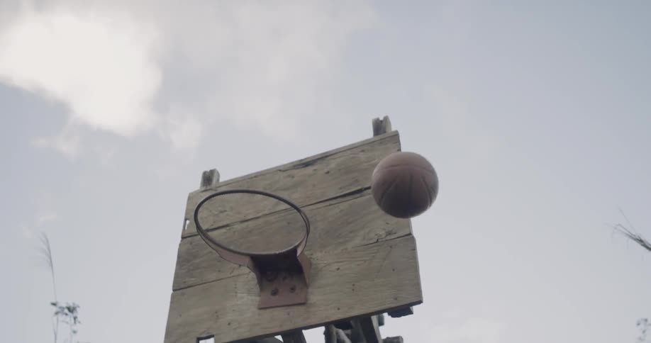 A basketball bounces off the hoop and backboard