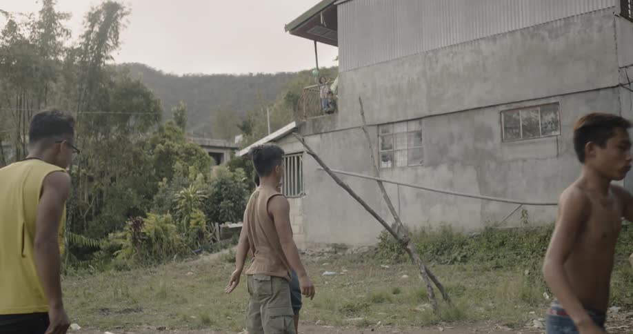 A group of kids play basketball