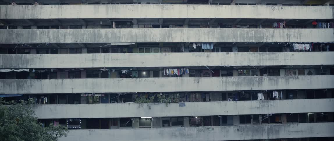 Laundry hangs on apartment balconies