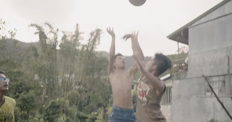 The children are playing a game of basketball