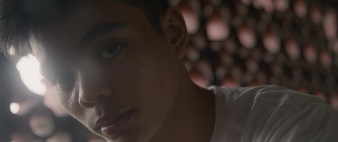 A teenage boy looks sad