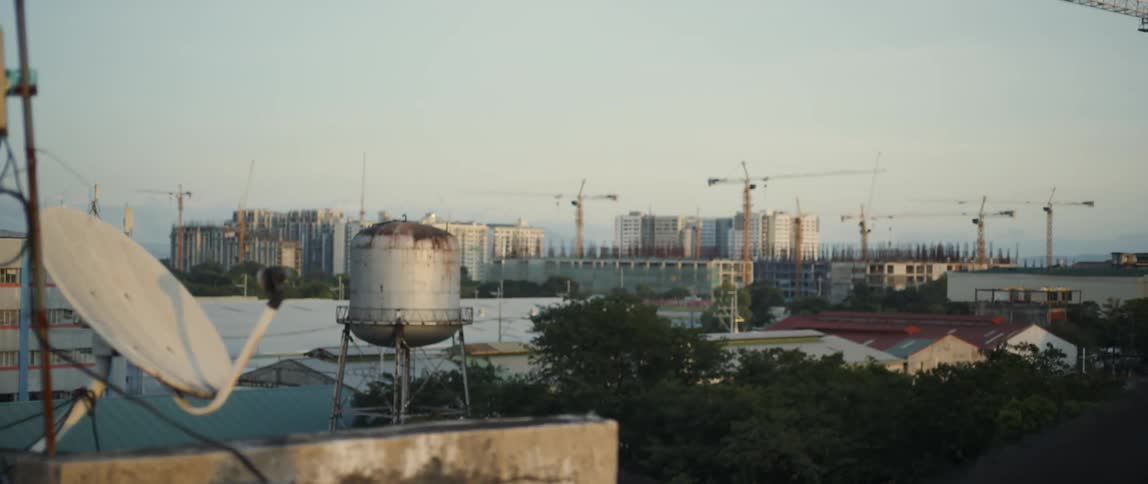 Dish on a roof top of a city