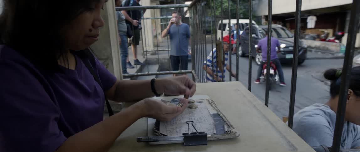 Woman counts a handful of change