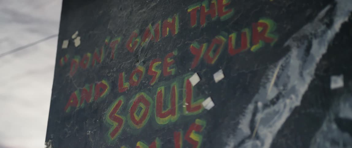 A sign is displaying an inspirational message as it sits outside in daylight