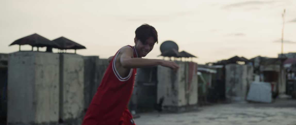 Boy in bulls jersey break dances
