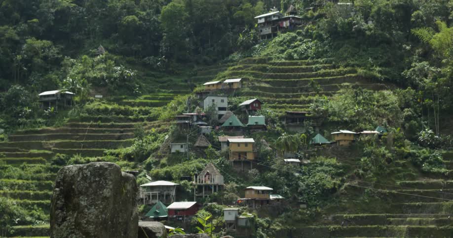 Houses sit on a mountainside