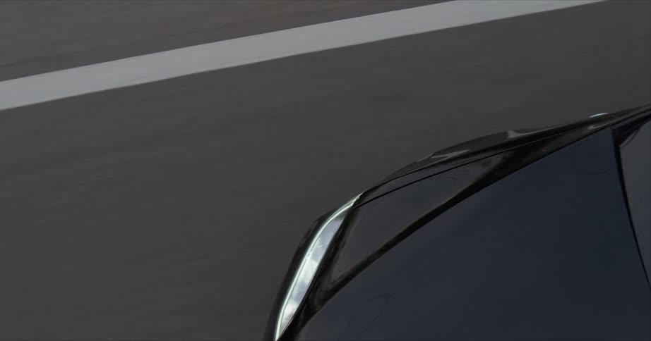 The car races down the road