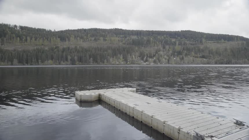 Lake water ripples around a dock
