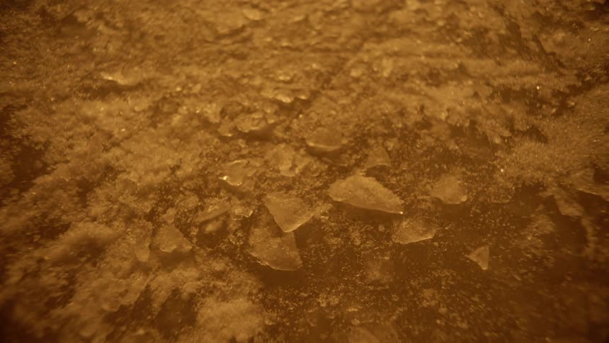 The ground is covered with ice chips