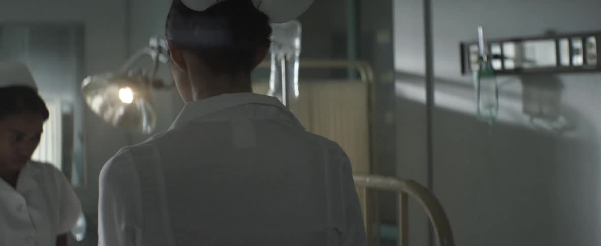 Nurse standing in a hospital room