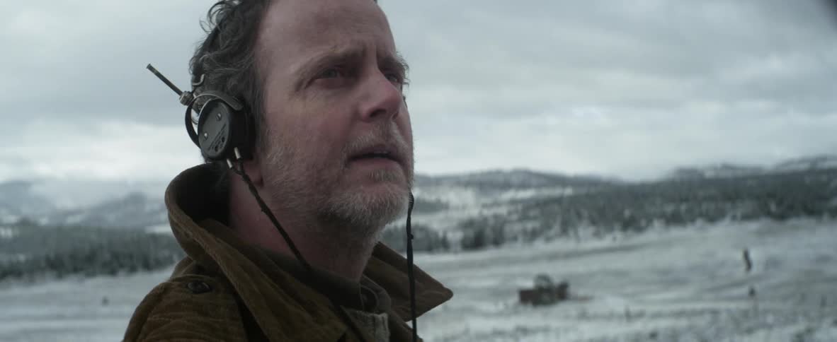 Man wearing headphones on a cloudy day