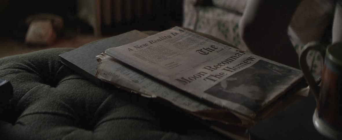 A person reading a newspaper