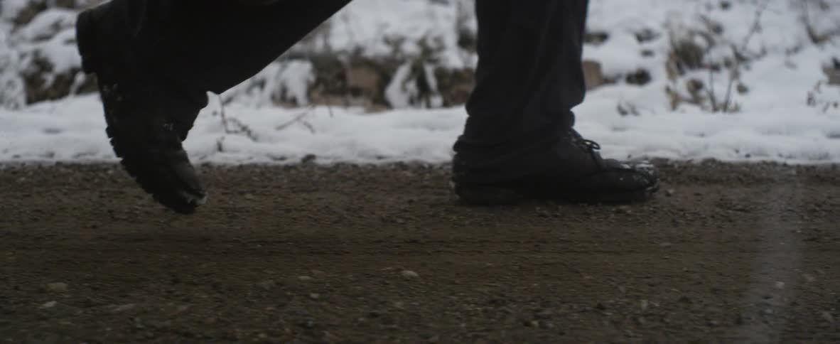 Someone walks along a path on a snowy day