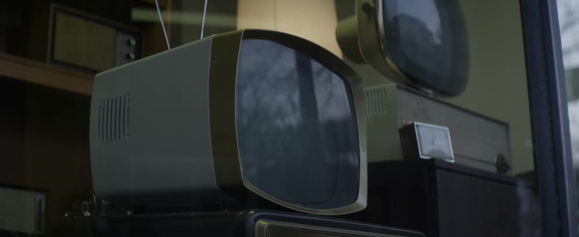 Television sets on display in a store window