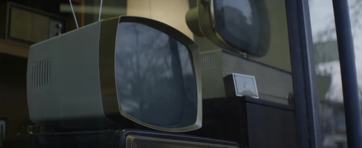 Television sets on display in a store window