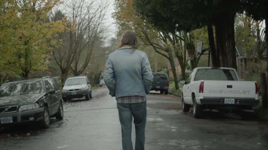 Man walks on a residential street