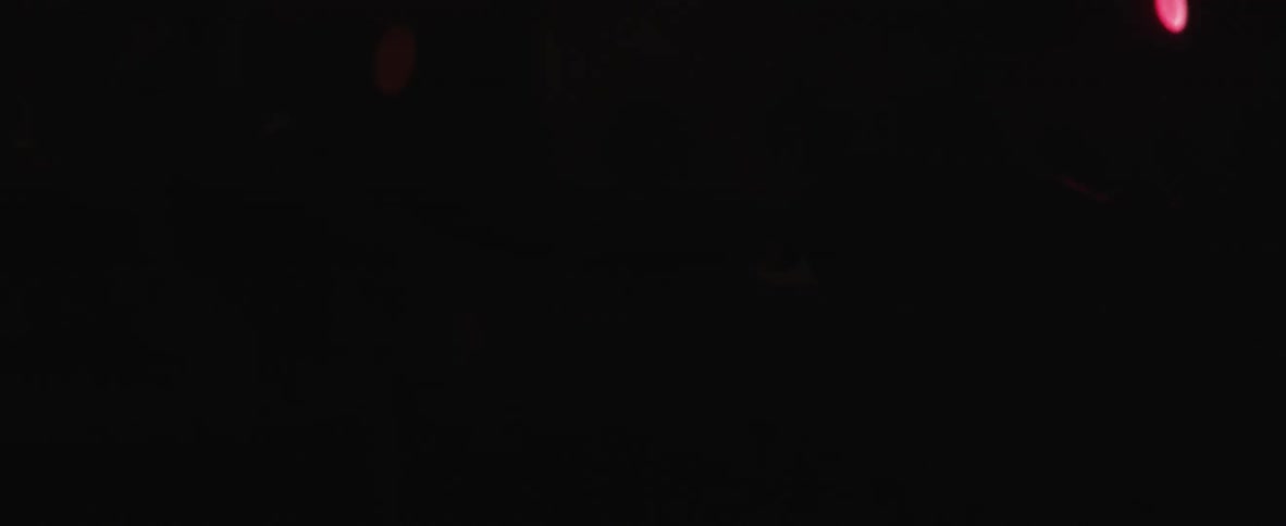 Some sort of tool or metal in the dark