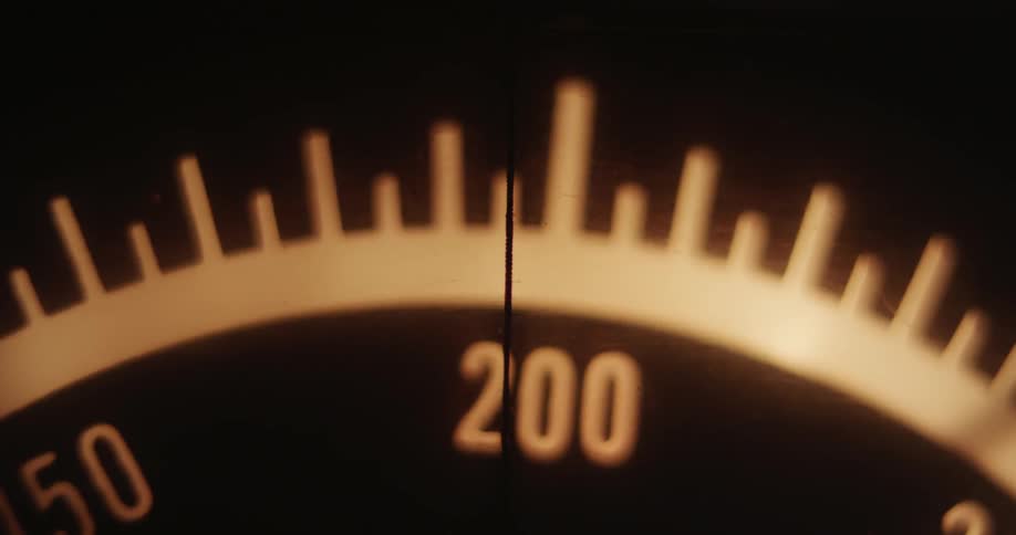 Close up of a lit dial moving