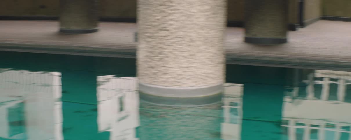 The man runs past the pool