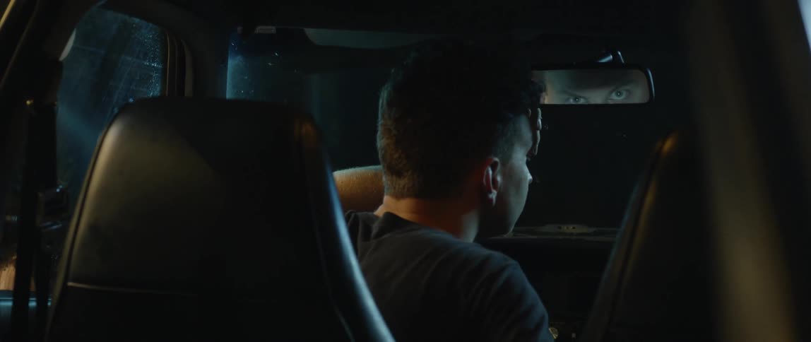 Man sits in a parked car