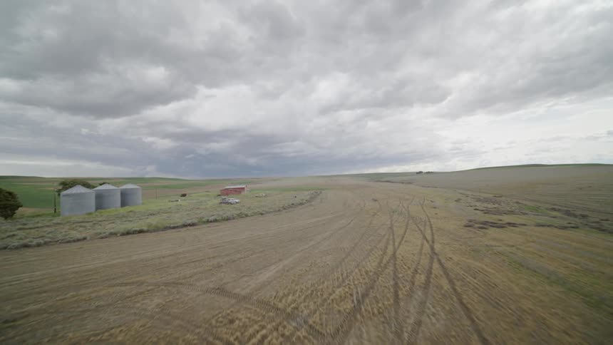 Flying low over vast rural farmland in the American west