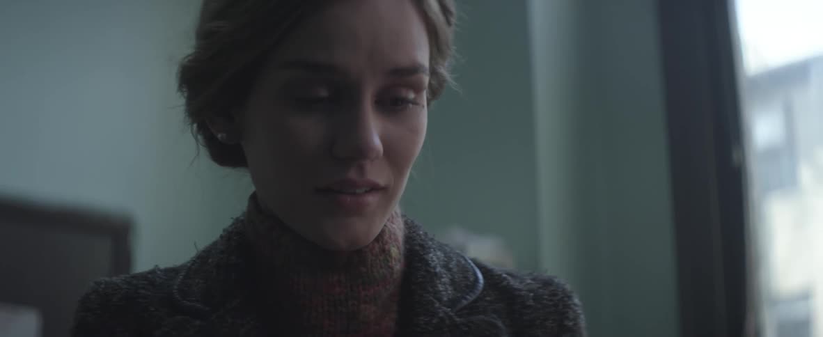 Woman standing in a room talking