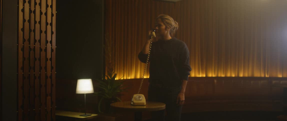 Woman talks on old phone