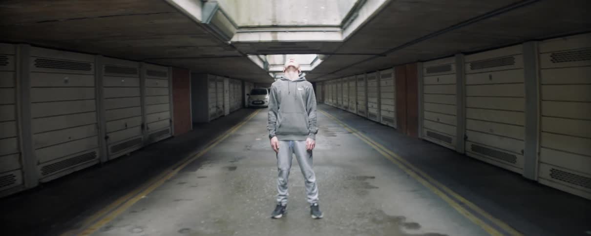 The man looks up before looking straight ahead